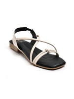 Zaysoo women's cream criss-cross strap flat sandals with a square toe and subtle metallic ornament.
