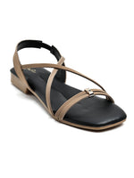 Zaysoo women's flat sandals in black with tan criss-cross straps and a back strap. Features a small metallic ornament.