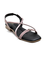 Zaysoo women's pink synthetic leather criss-cross strap flat sandals with back strap and metallic ornament.